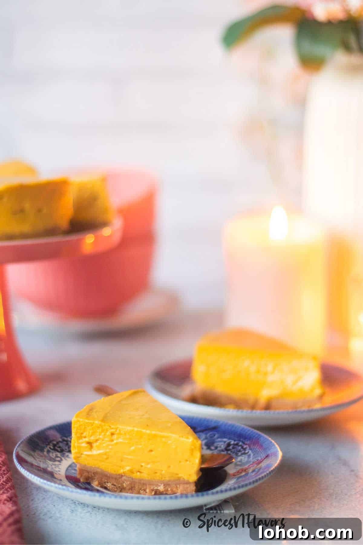 Eggless Baked Mango Cheesecake Recipe: Creamy Tropical Slice 12 slice of mango cheesecake placed on a blue plate