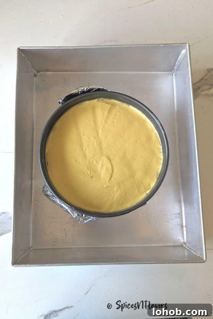 Eggless Baked Mango Cheesecake Recipe: Creamy Tropical Slice 9 place the springform pan in a larger pan