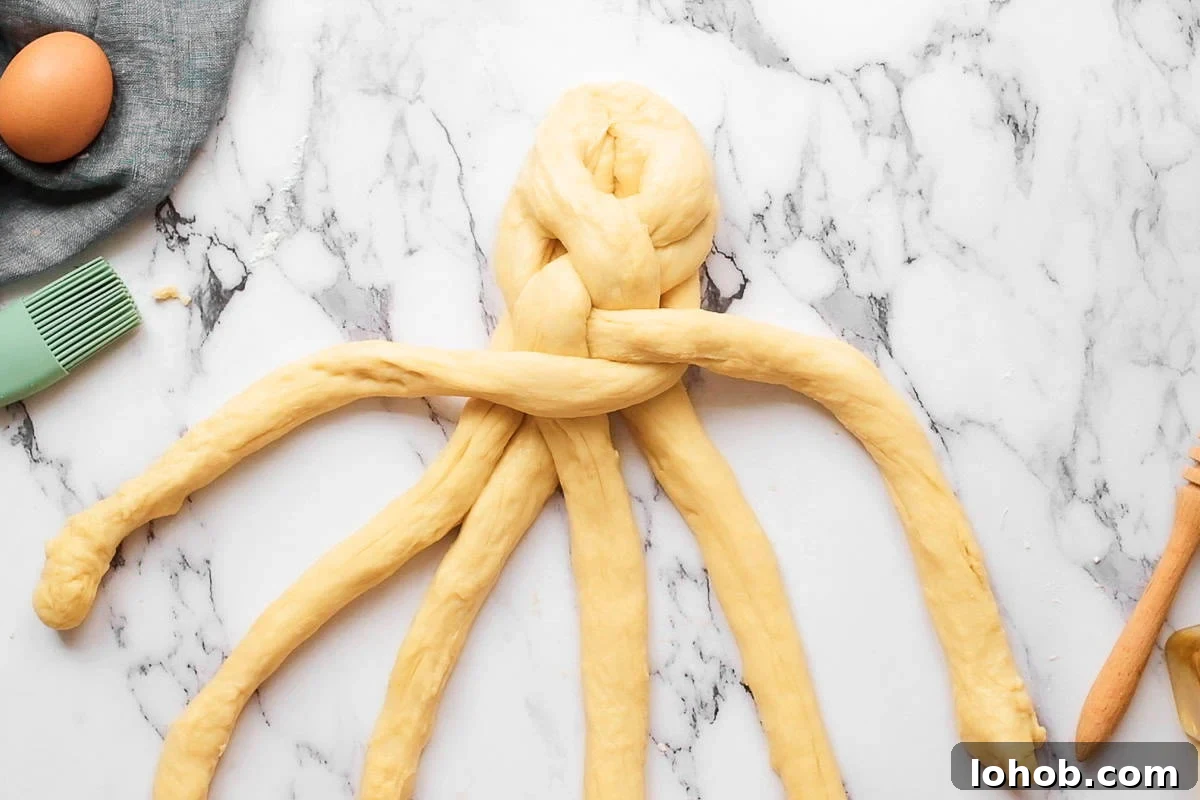 braiding homemade challah bread dough.