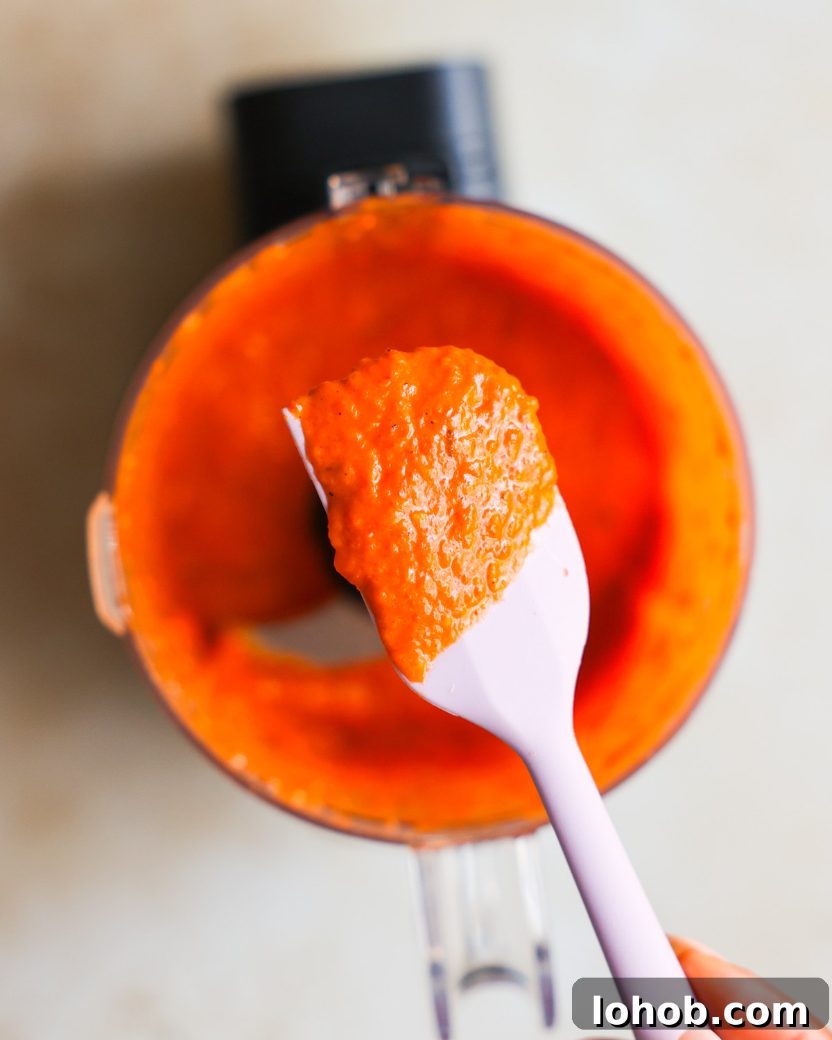 red pepper sauce on spatula