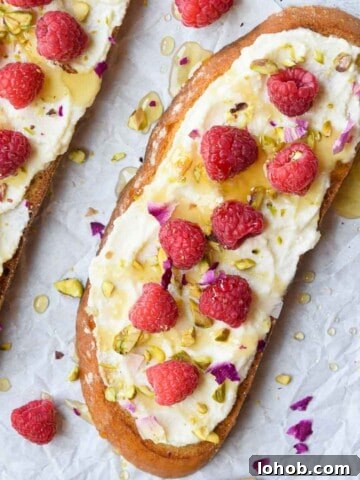 Overhead and close-up view of lemon ricotta toast on white parchment paper.