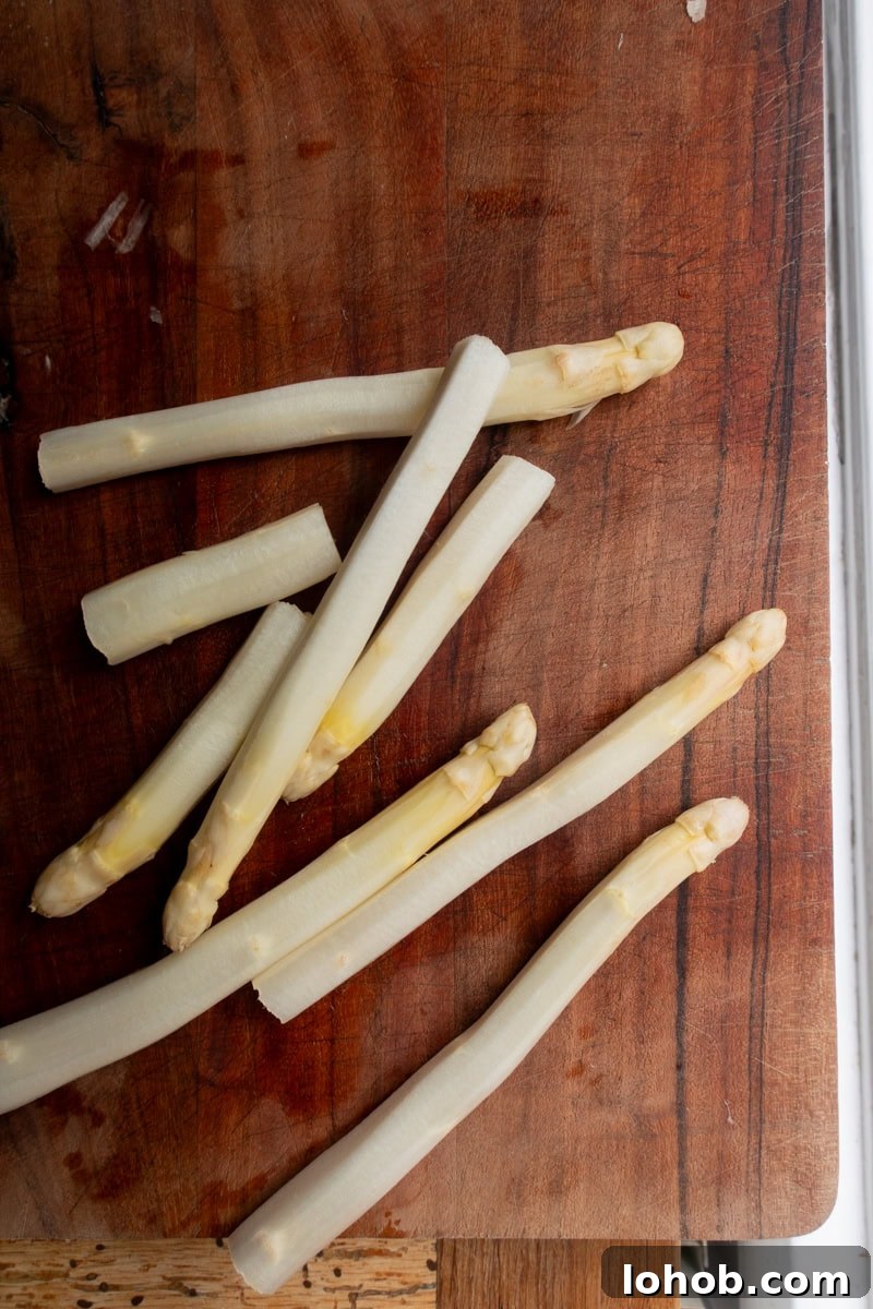 White asparagus on wooden board