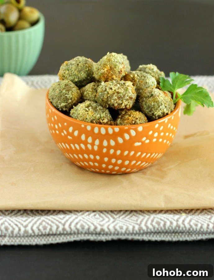 Oven Fried Stuffed Olives- Paleo, Low Carb & Gluten Free sausage stuffed olives that are gluten free breaded and oven fried.