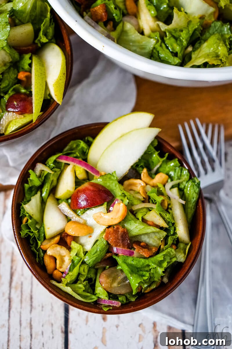 Crunchy Cashew Salad with Lime-Ginger Dressing 3 A serving of Cashew Nut Salad in a brown bowl.