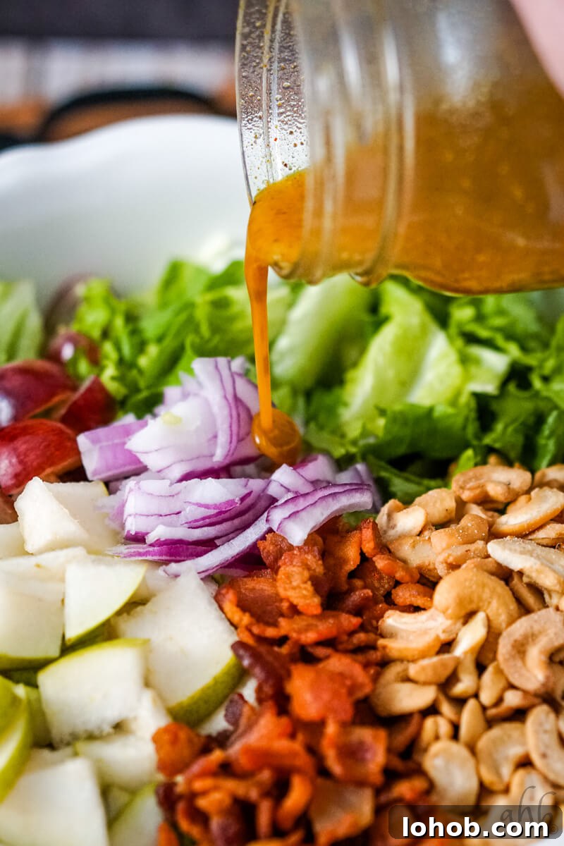 Crunchy Cashew Salad with Lime-Ginger Dressing 9 The vinaigrette is poured over the salad.