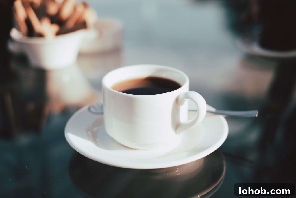 Attending RootsTech: How to Make the Most of a Genealogy Conference 4 coffee cup on a table with a spoon on the saucer