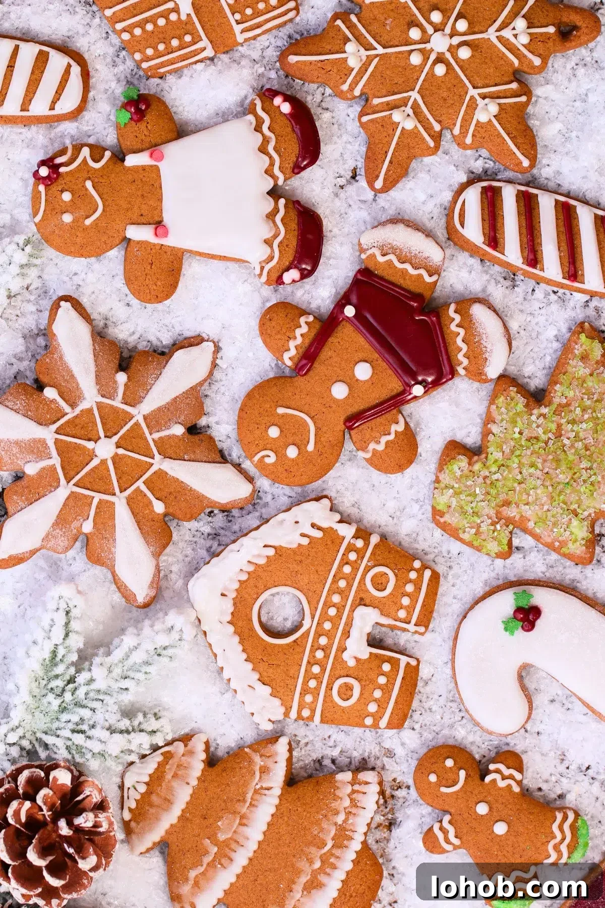 iced homemade gingerbread cookies decorated on a pile of snow