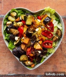 overhead shot of salad in heart shape salad bowl