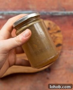 overhead shot of salad dressing in small glass jar