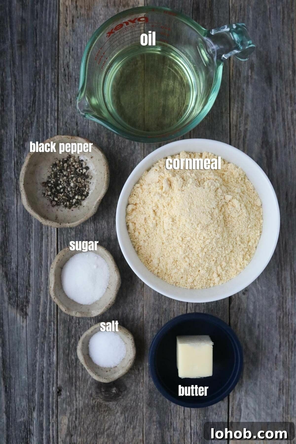 Southern Hot Water Cornbread Recipe — Crispy Skillet Cornbread 3 Ingredients for making hot water cornbread arranged on a wooden surface.