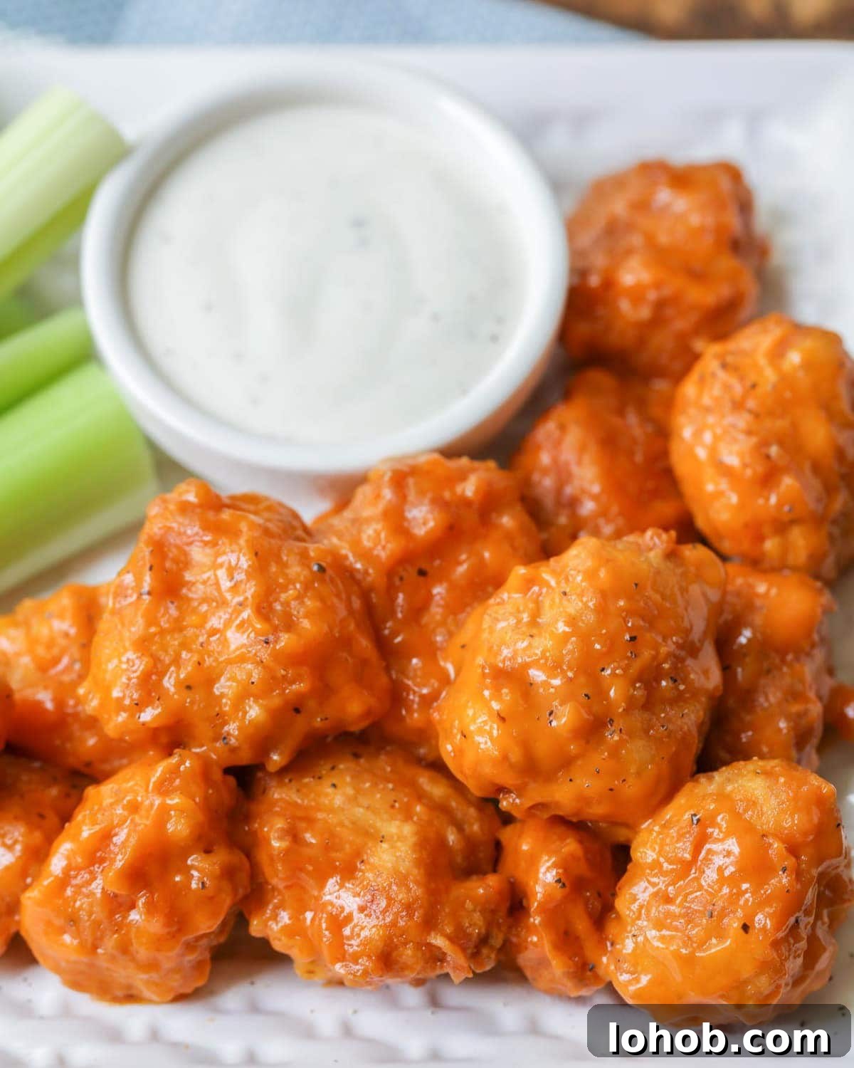 Buffalo wings - boneless buffalo wings served with ranch dressing and celery sticks.