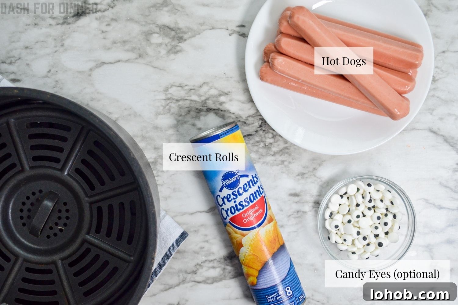Crispy Mummy Hot Dogs for Halloween – Air Fryer & Oven Guide 4 The ingredients needed to make mummy dogs in the Air Fryer: hot dogs, crescent rolls, and candy eyes.