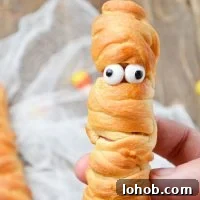 Crispy Mummy Hot Dogs for Halloween – Air Fryer & Oven Guide 10 A crescent roll wrapped hot dog, with googly eyes.