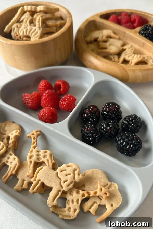 Animal crackers served with blackberries and raspberries.