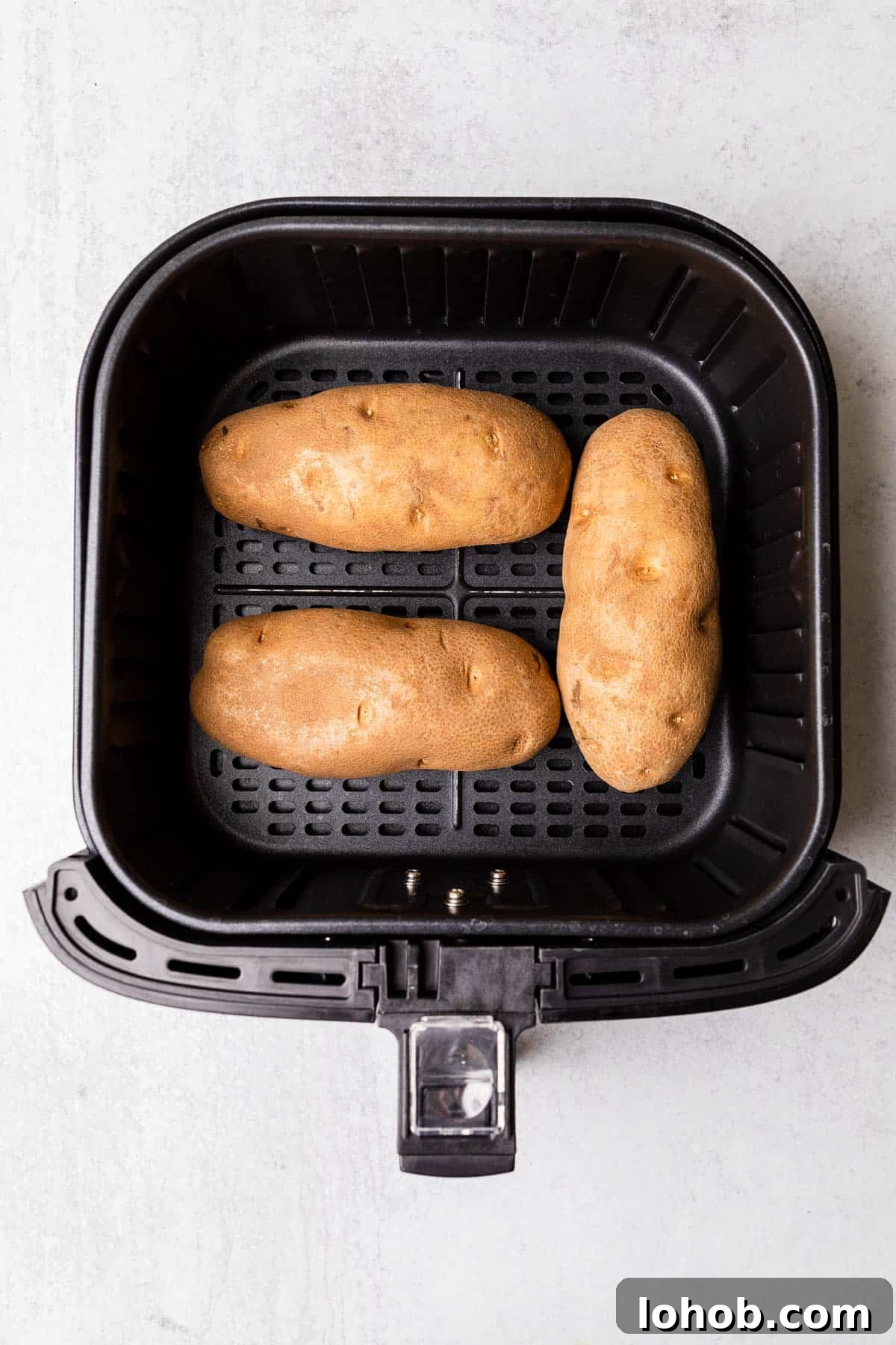 making the recipe with potatoes in an air fryer