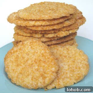 Frosted Flakes Sugar Cookies stacked on a blue plate