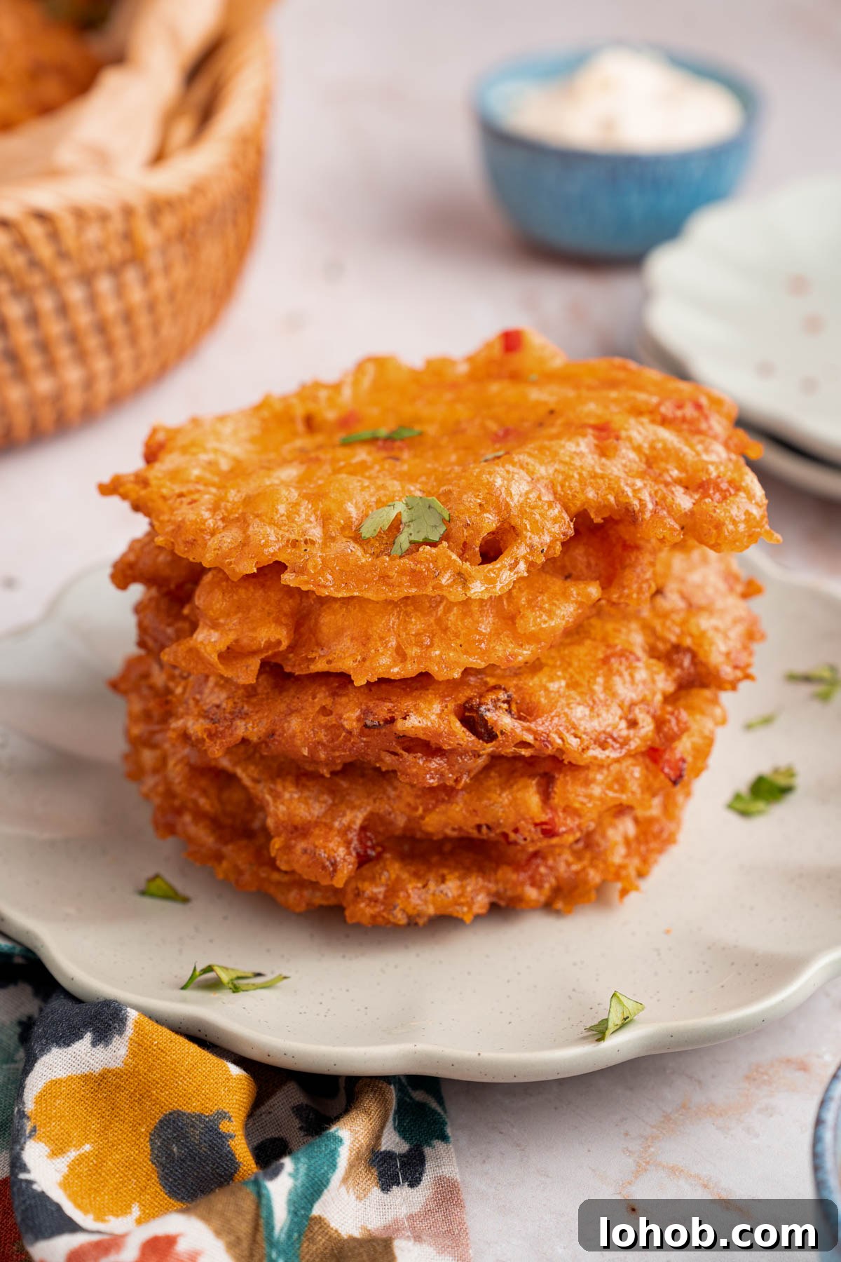 Crispy Bacalaitos: Authentic Puerto Rican Codfish Fritters 8 A stack of bacalaitos on a white plate for serving.