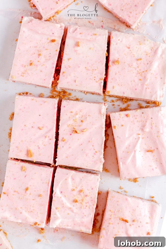 Strawberry Cheesecake Bars start with a graham cracker crust, a layer of cheesecake, and then a no-bake strawberry cheesecake layer.