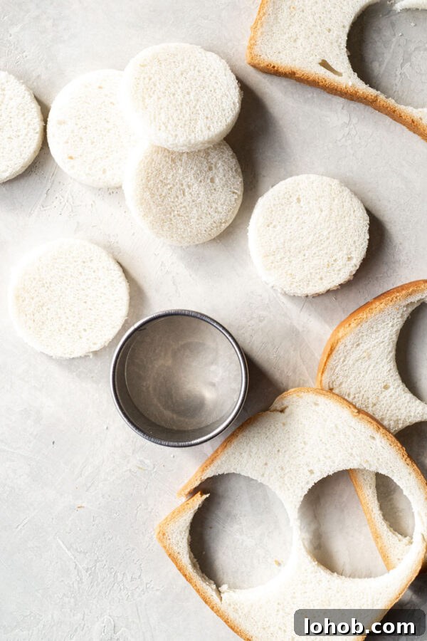 Cutting bread with a cookie cutter.