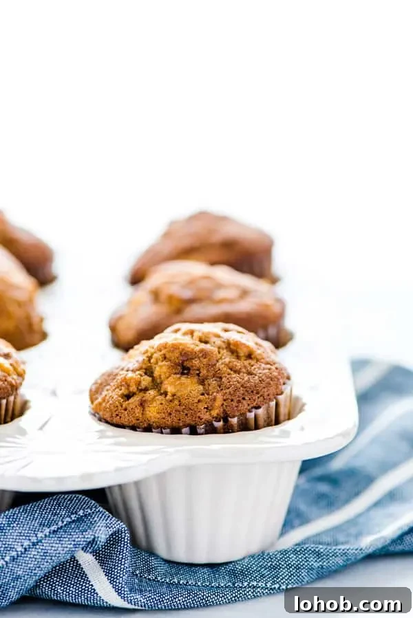 Gluten Free Apple Muffins in a white muffin pan