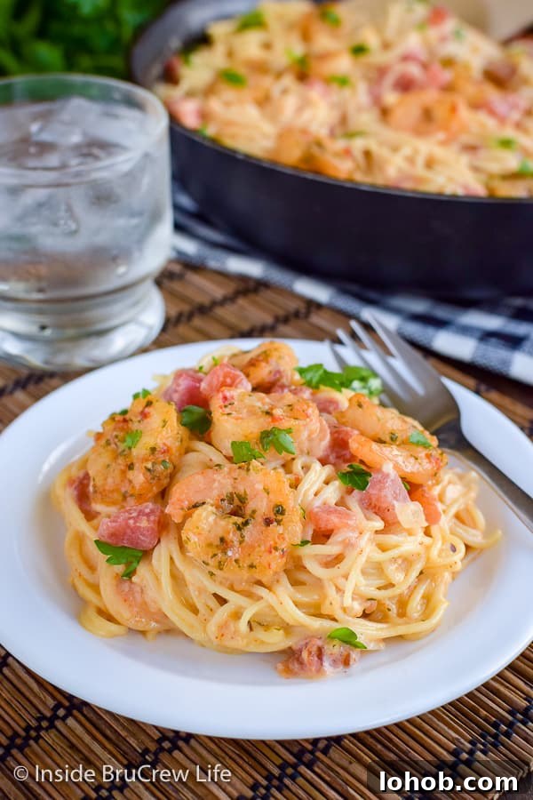 Spicy Parmesan Shrimp Scampi - shrimp and pasta tossed in an easy cheese sauce makes a delicious comfort food meal in minutes. #pasta #shrimp #shrimpscampi #easyrecipe #parmesan