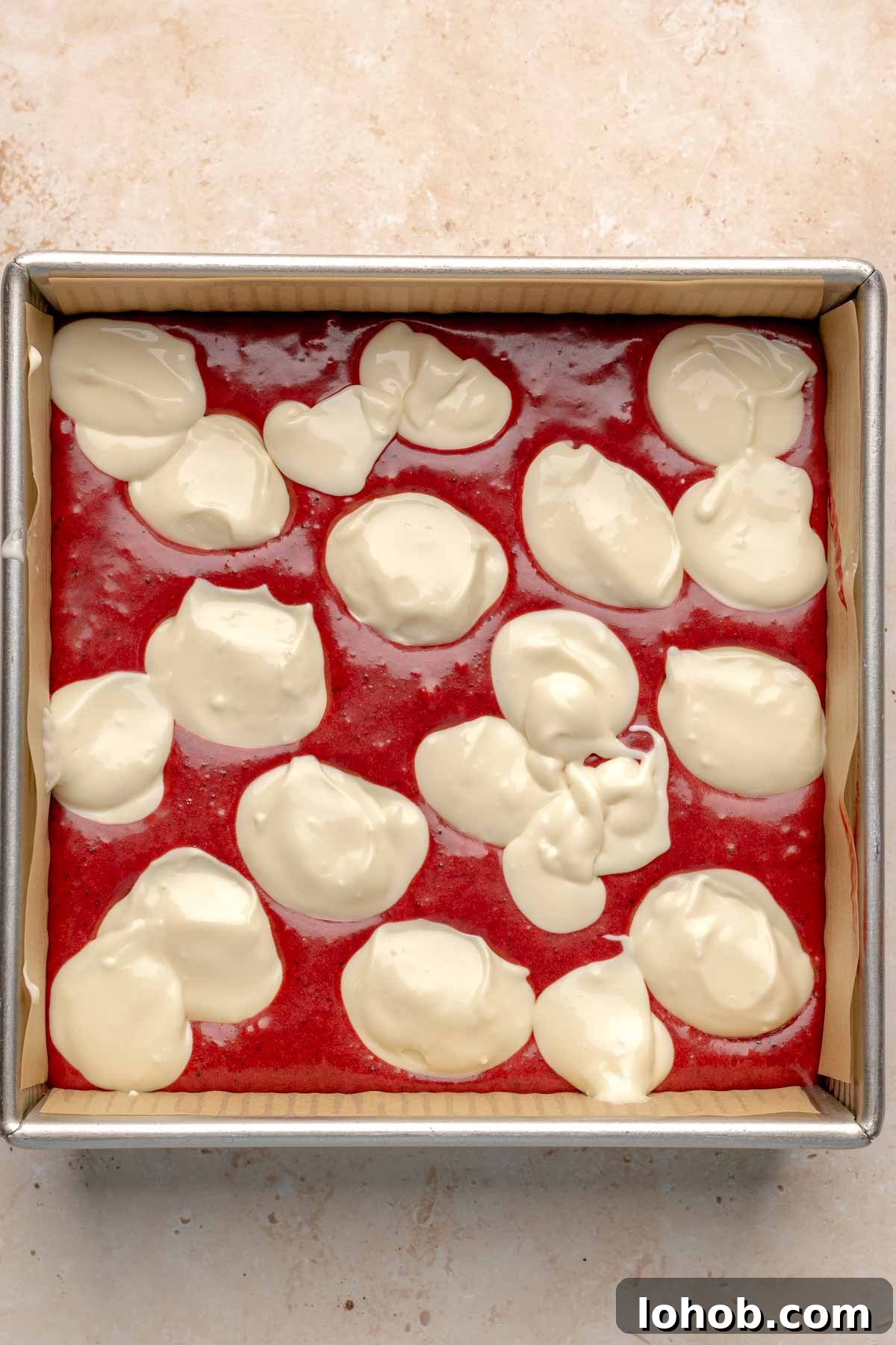 Fudgy Red Velvet Brownies with Cream Cheese Swirl 9 Dollops of cream cheese all over the brownie batter.