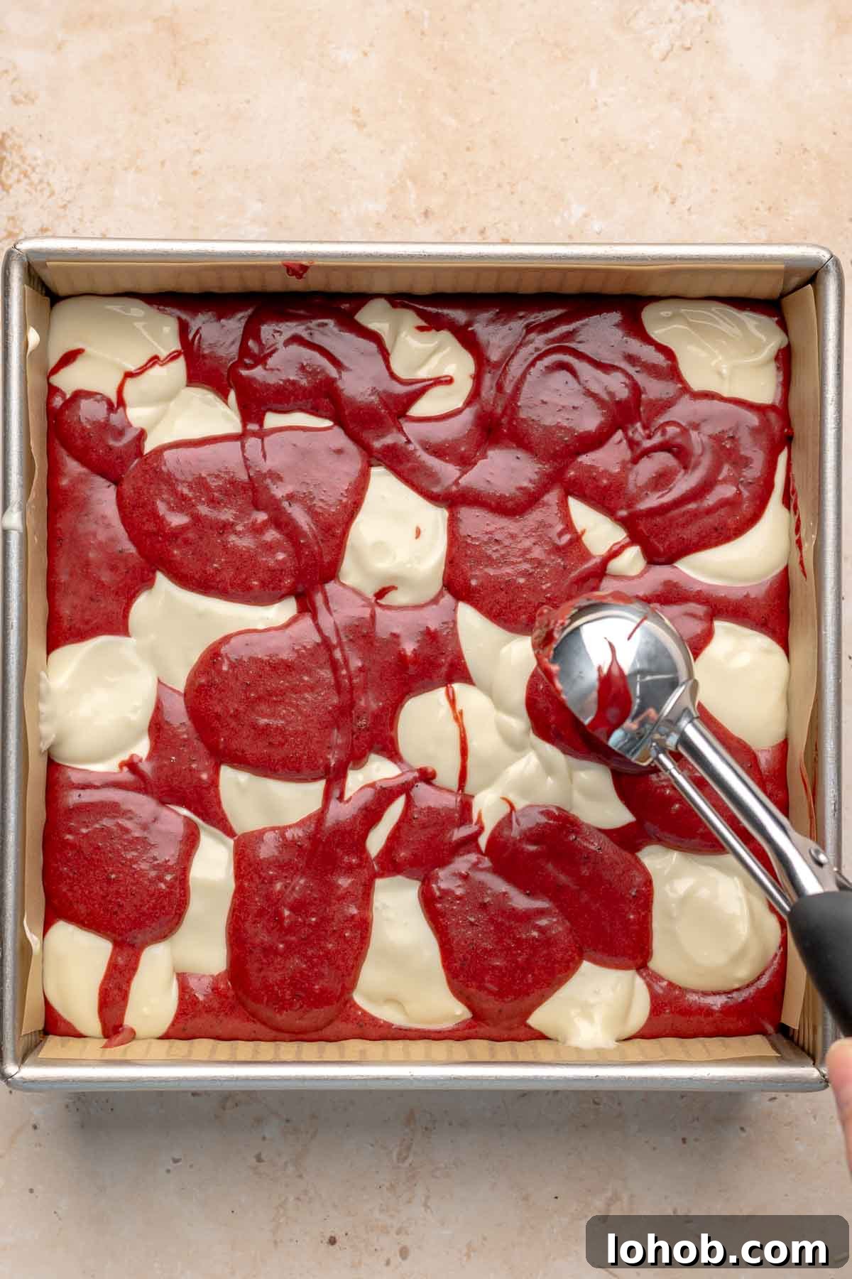 Fudgy Red Velvet Brownies with Cream Cheese Swirl 10 A cookie scoop adds more red velvet batter in between the cream cheese dollops.