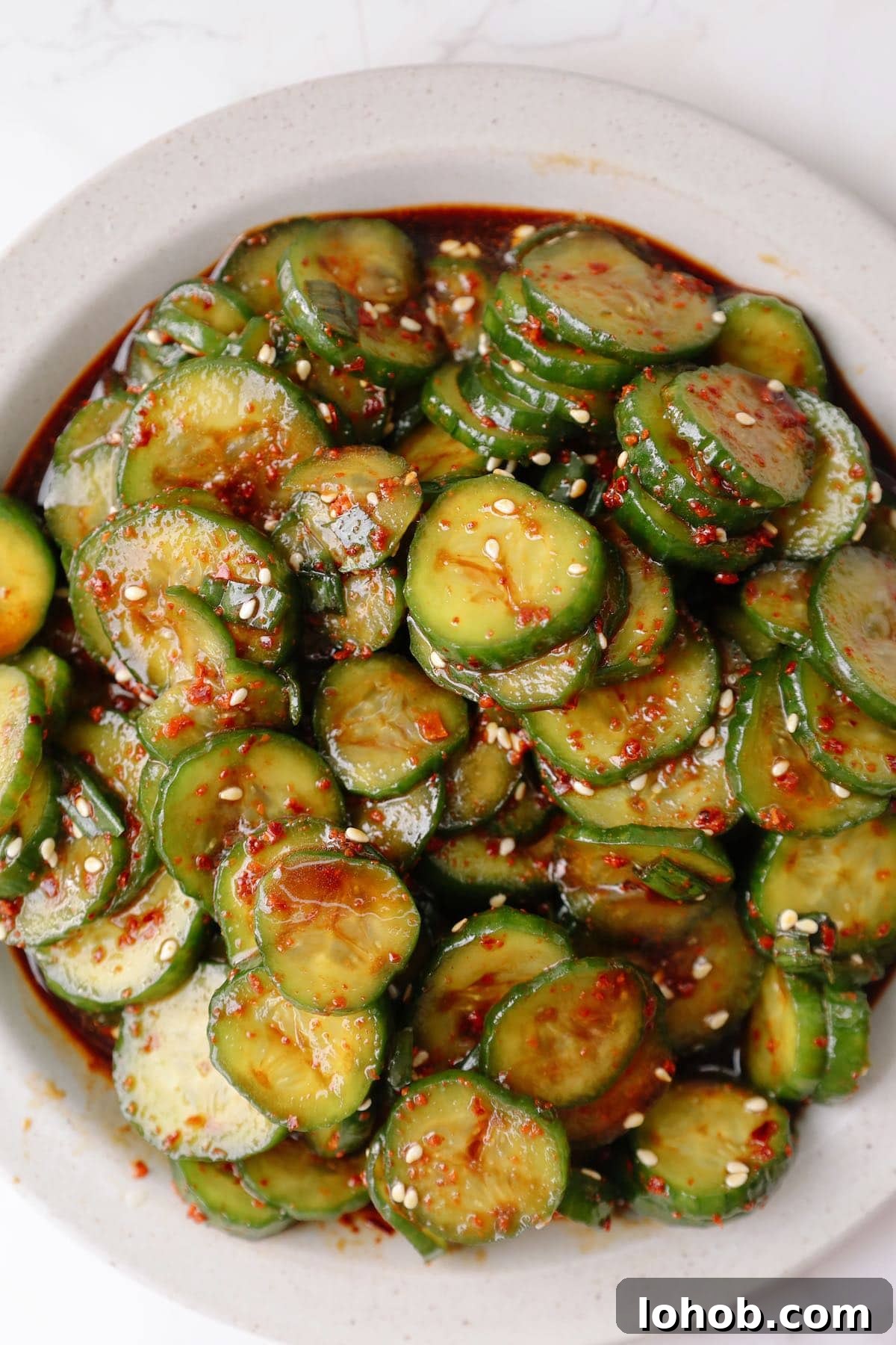 Korean Cucumber Salad (Oi Muchim) Recipe for Bold, Crunchy Flavor 7 Step four: garnish and serve the Korean cucumber salad.