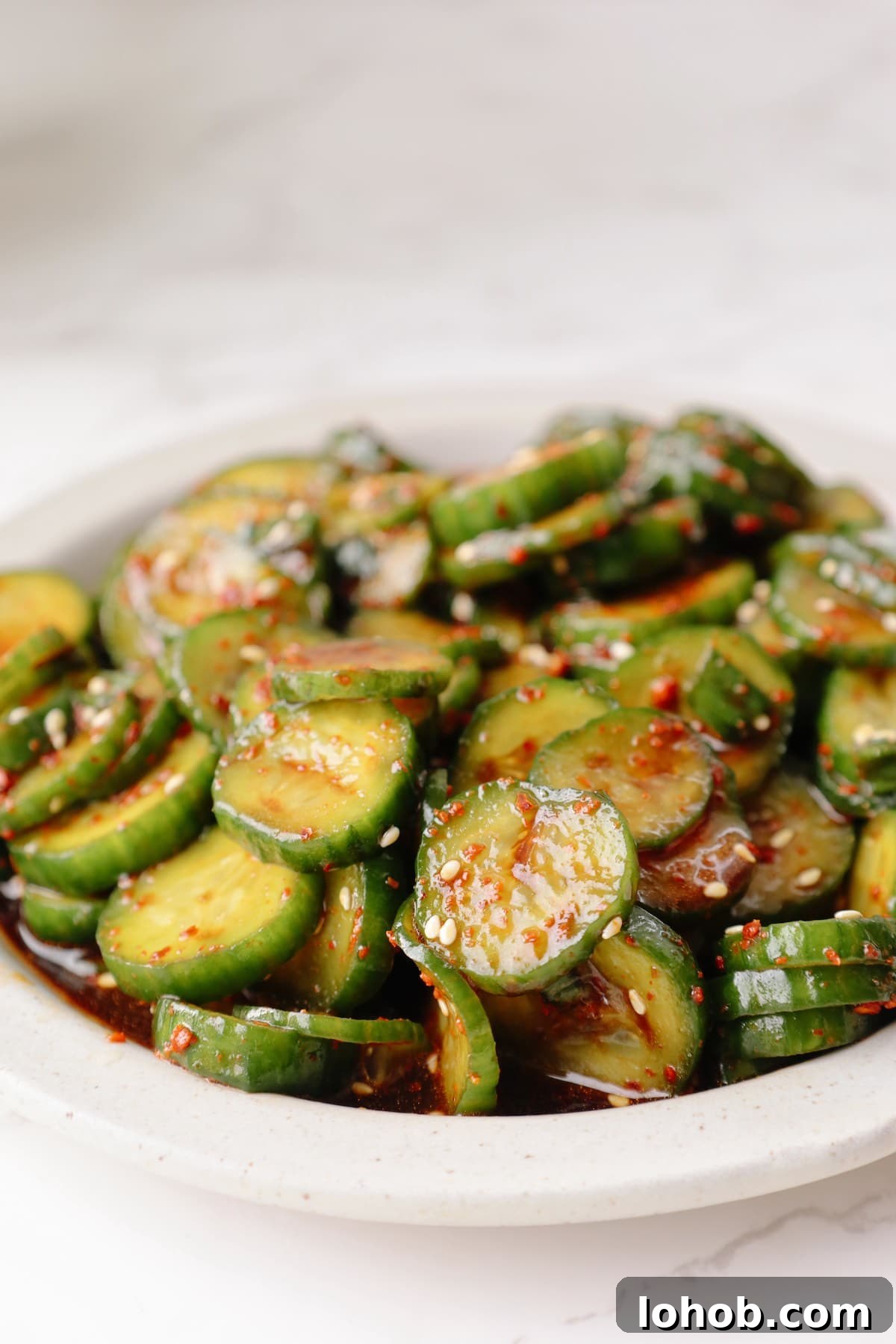 Korean Cucumber Salad (Oi Muchim) Recipe for Bold, Crunchy Flavor 9 Korean cucumber salad on a white plate.
