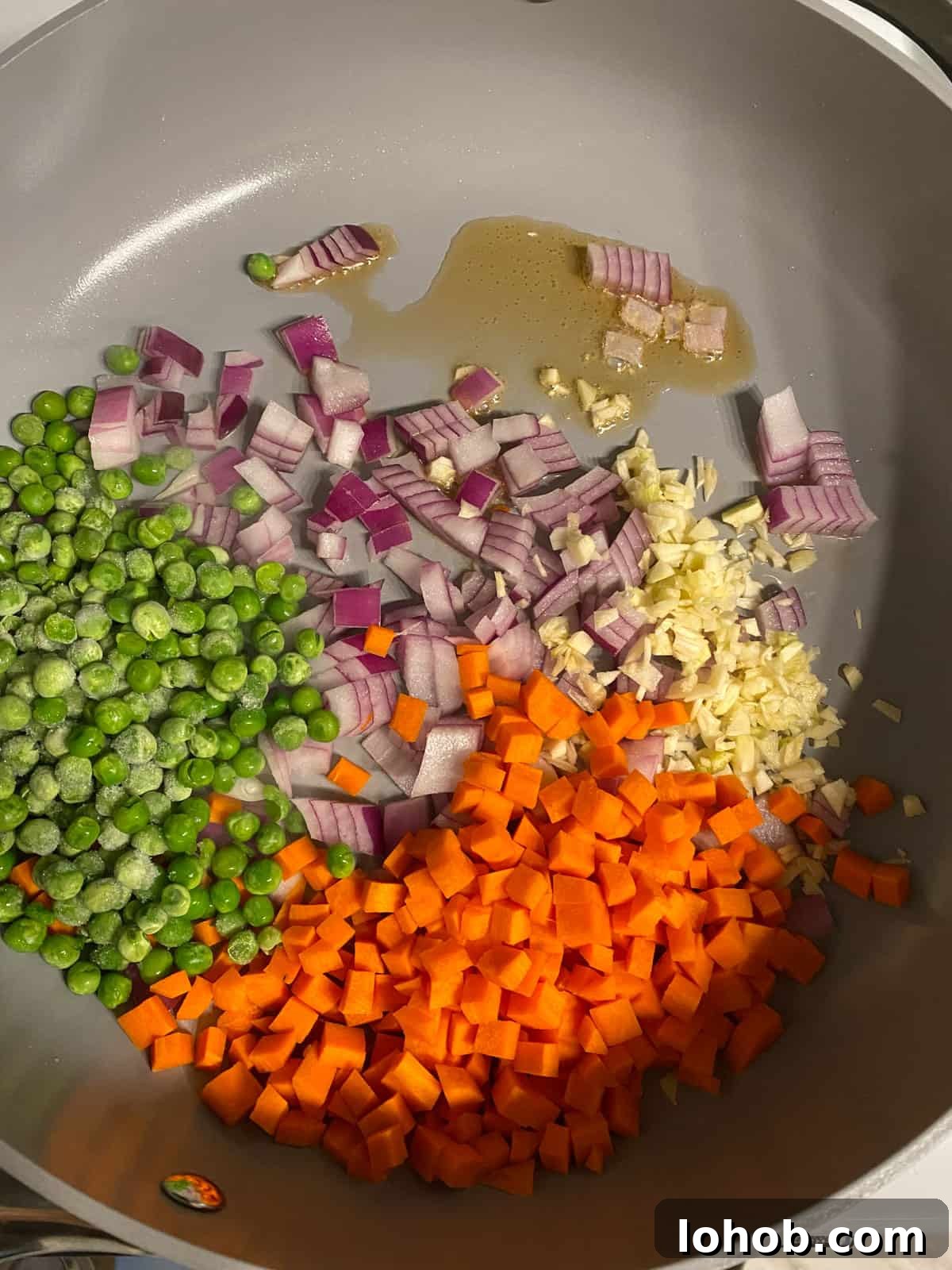 ingredients for Easy Vegetable Brown Fried Rice added to a pan
