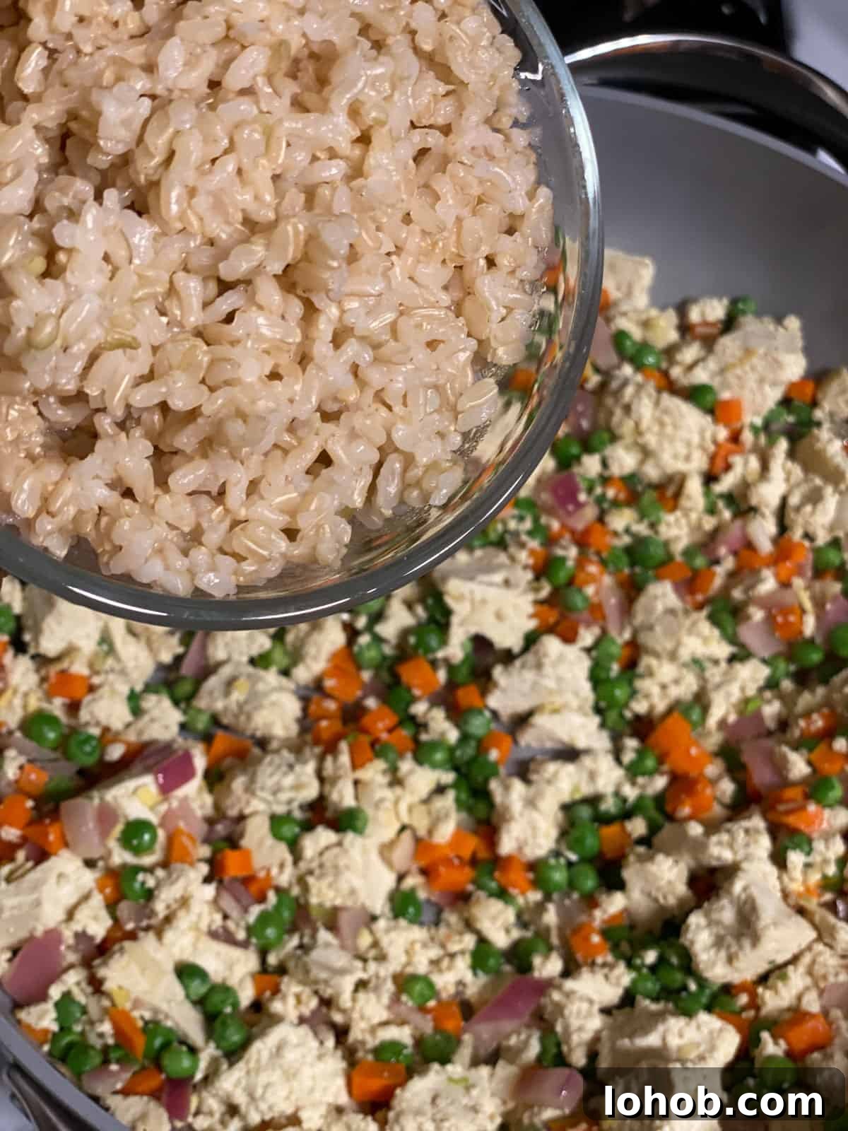 process shot of adding rice to pan