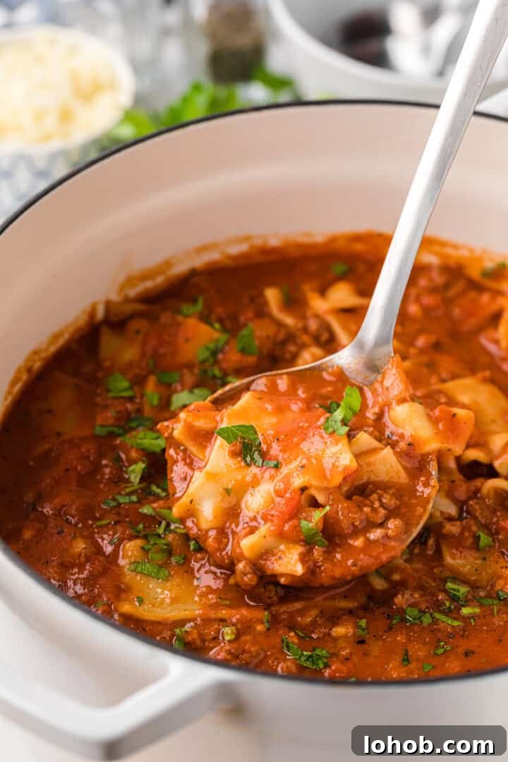 Hearty Lasagna Soup Recipe: Comforting One-Pot Dinner 2 Lasagna Soup served out of the pot with ladle.