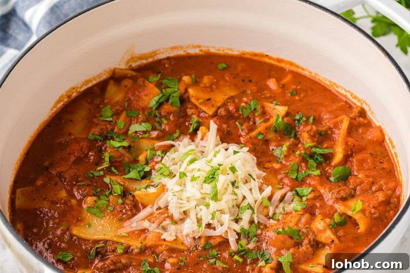 Hearty Lasagna Soup Recipe: Comforting One-Pot Dinner 4 Lasagna Soup in the pot topped with mozzarella cheese.