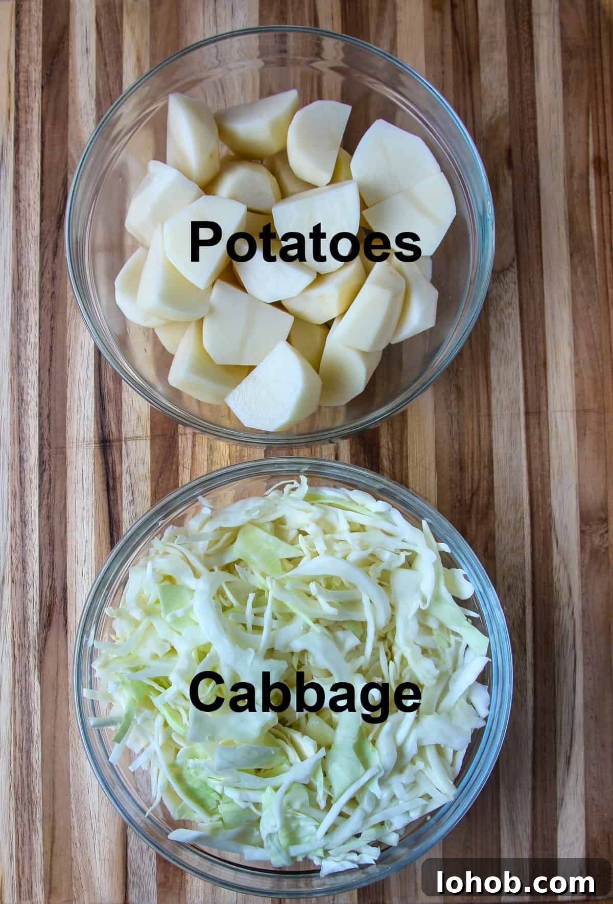 Colcannon: Traditional Irish Mashed Potatoes with Cabbage 4 Ingredients to make the recipe on a wooden cutting board.