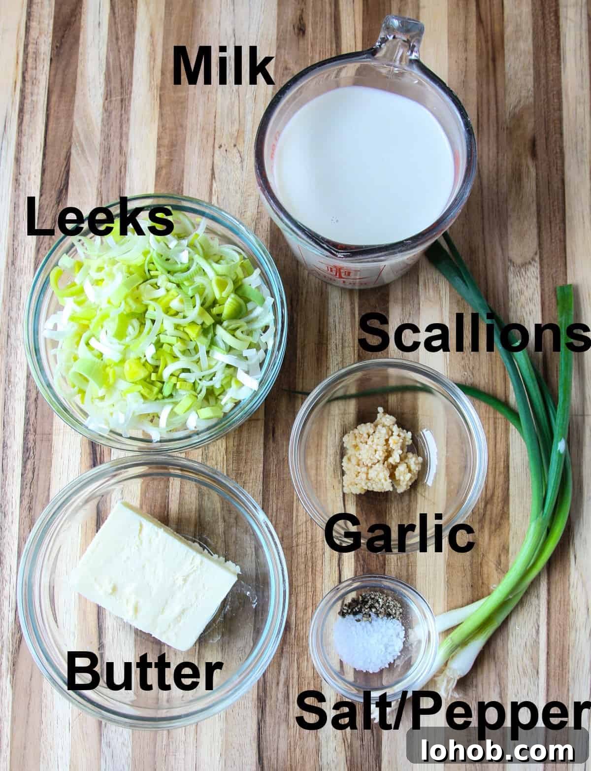 Colcannon: Traditional Irish Mashed Potatoes with Cabbage 5 More recipe ingredients on a wooden board.
