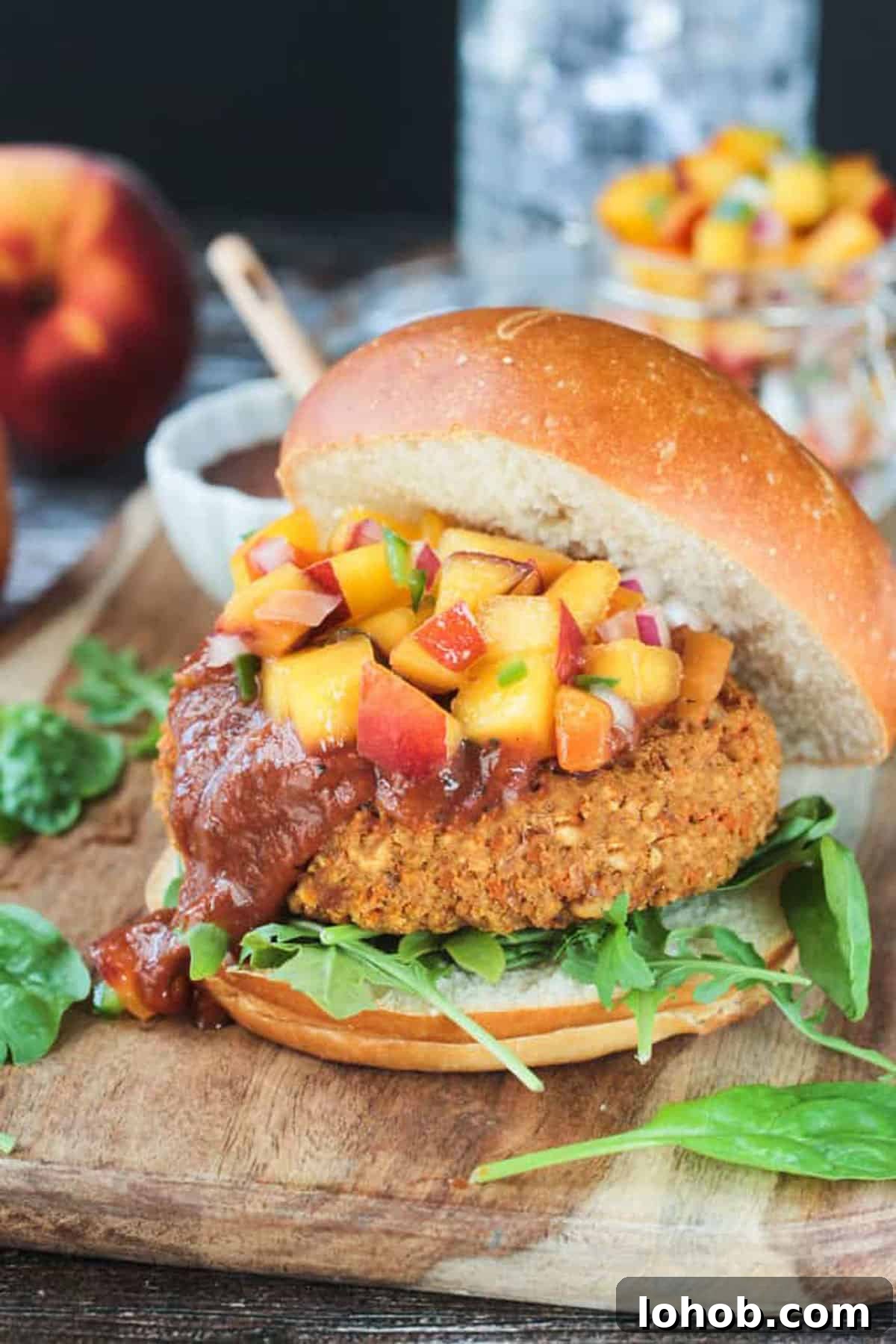 Savory Chickpea Veggie Burger Recipe for Juicy Plant-Based Patties 6 Chickpea veggie burger topped with fresh peach salsa.