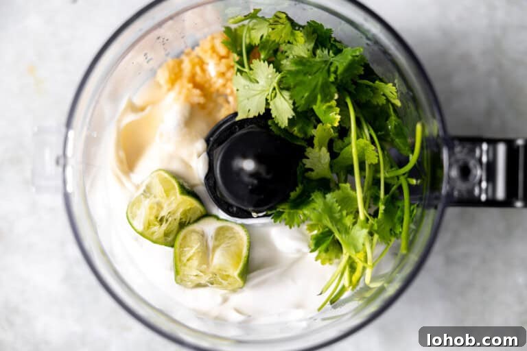 Cilantro Lime Sauce Recipe: Zesty Creamy Dip for Tacos & Grilled Meats 6 Ingredients needed to make cilantro lime sauce in a food processor.