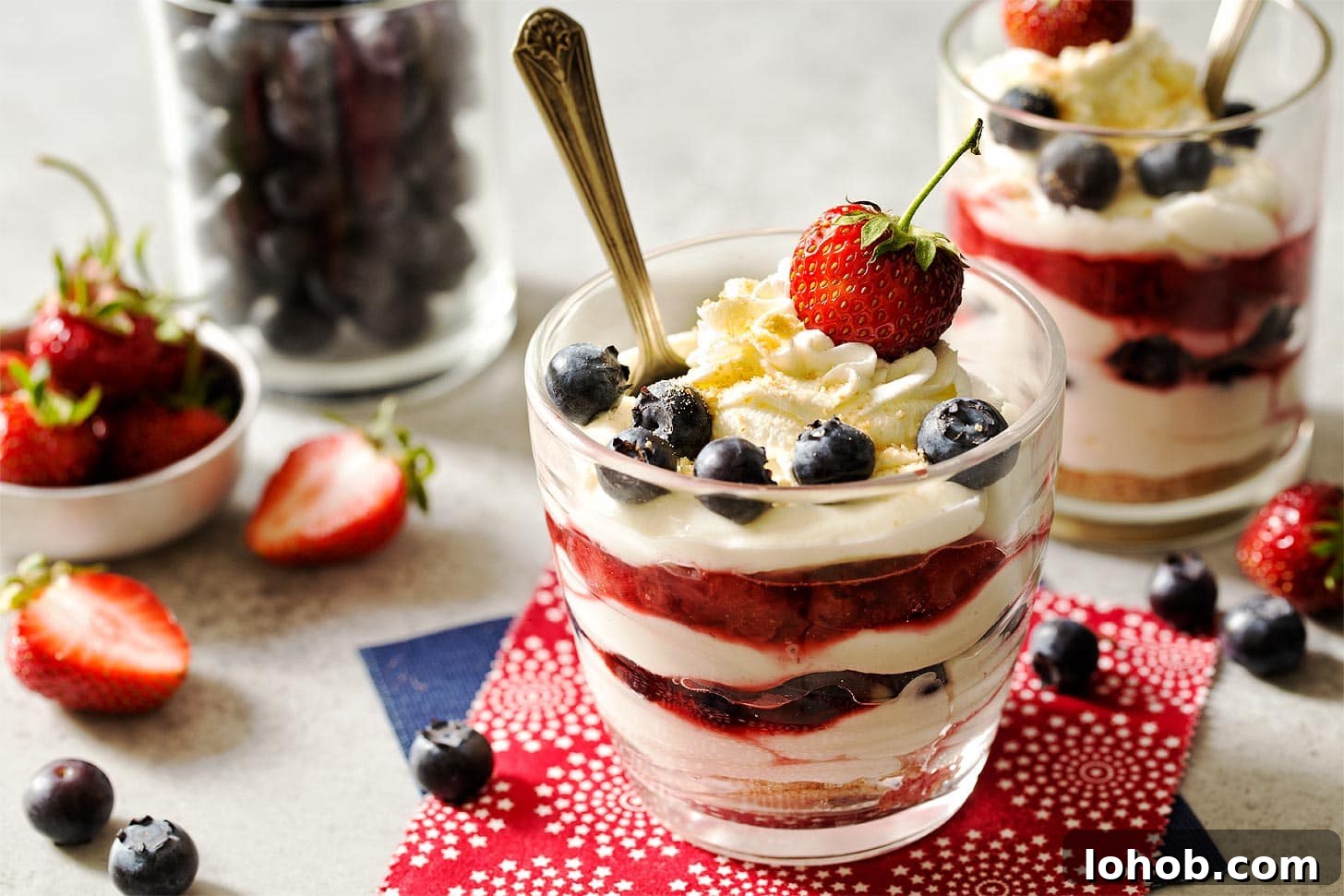 Cheesecake Parfait Dessert with strawberries and blueberries