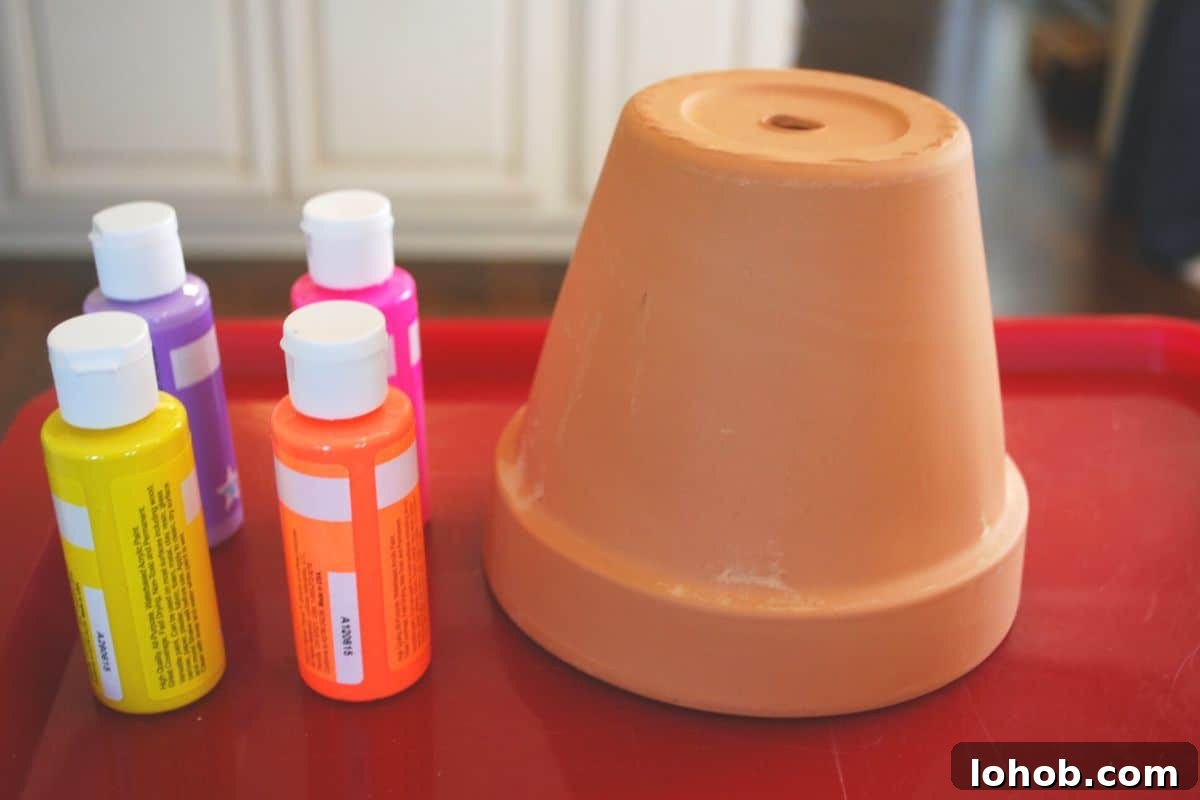 Drip-Painted Flower Pots: Colorful DIY Planter Ideas 3 terra cotta pot and paint.
