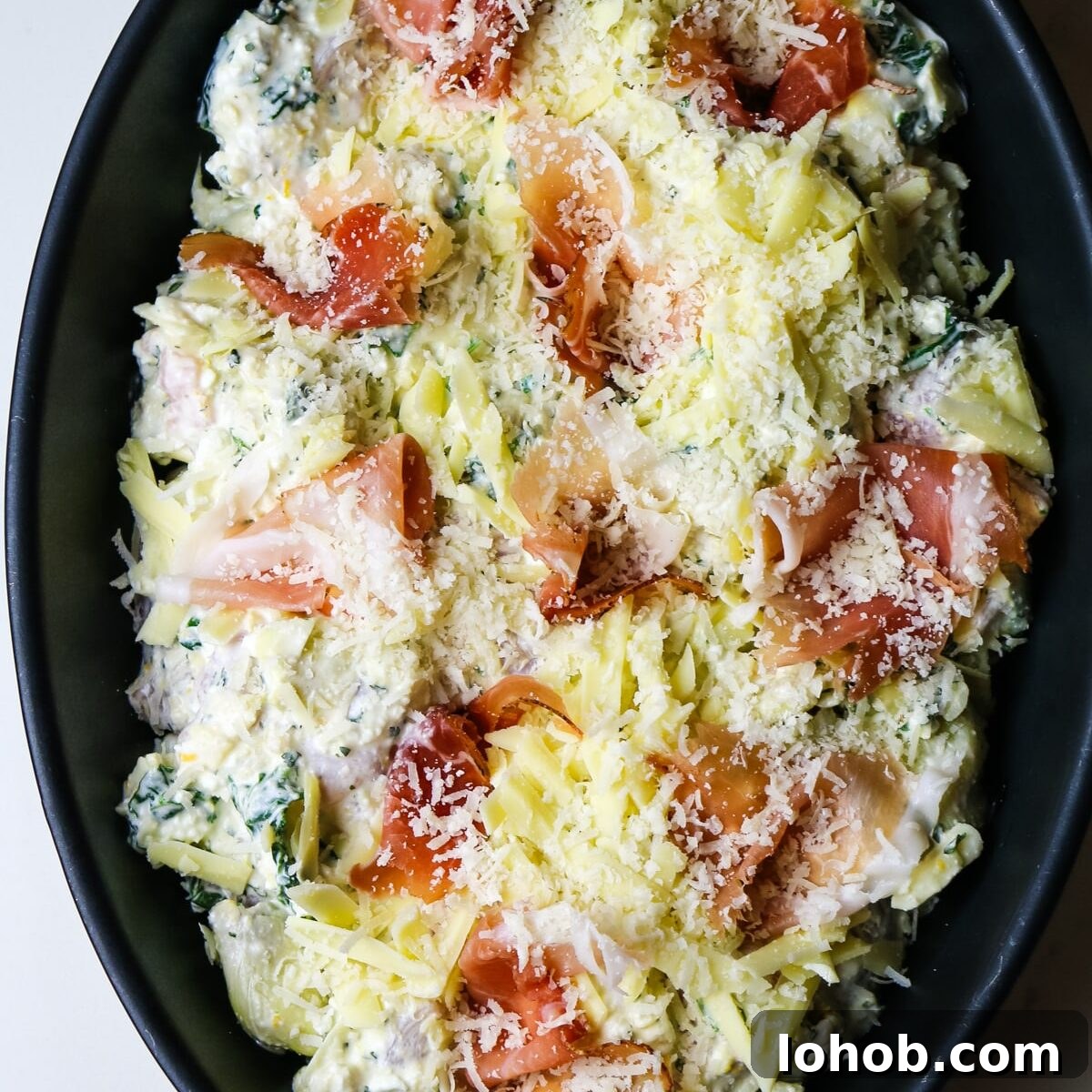 Spinach, Chicken & Artichoke Casserole Recipe with Light Cream Sauce 9 artichoke spinach and chicken in a baking dish with prosciutto.