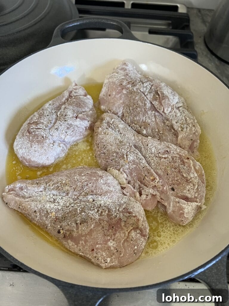 One-Pan Chicken Pomodoro Recipe for Quick Weeknight Dinners 10 Searing the seasoned and floured boneless, skinless chicken breast in an oil and butter combination in pan.