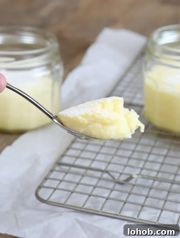 A spoon with yellow cake on it