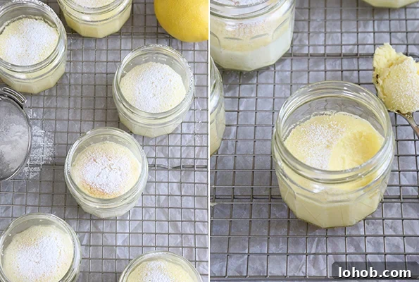 Miniature yellow cakes in jars on a wire rack, with a lemon