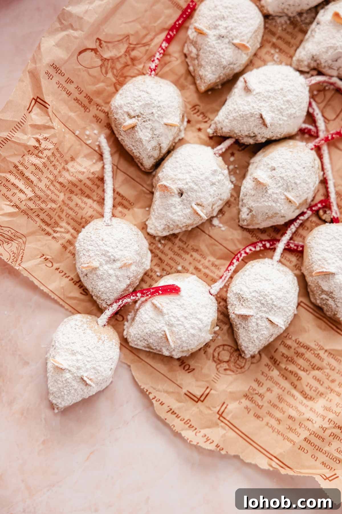 snowball cookies shaped into christmas mice