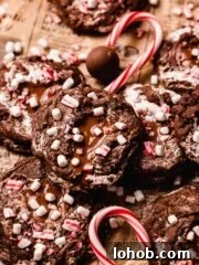 hot chocolate cookies with mini marshmallows and candy cane pieces