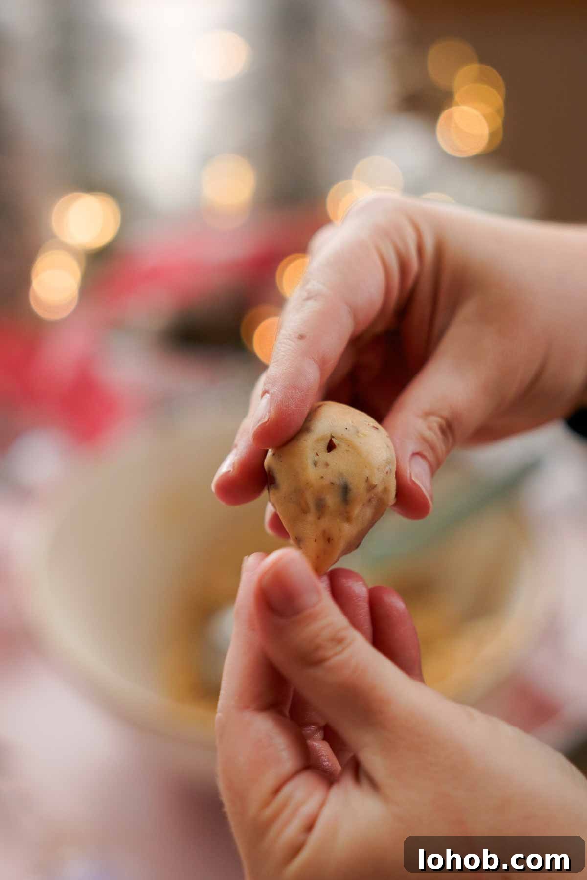 shaping snowball cookie dough into mouse shapes