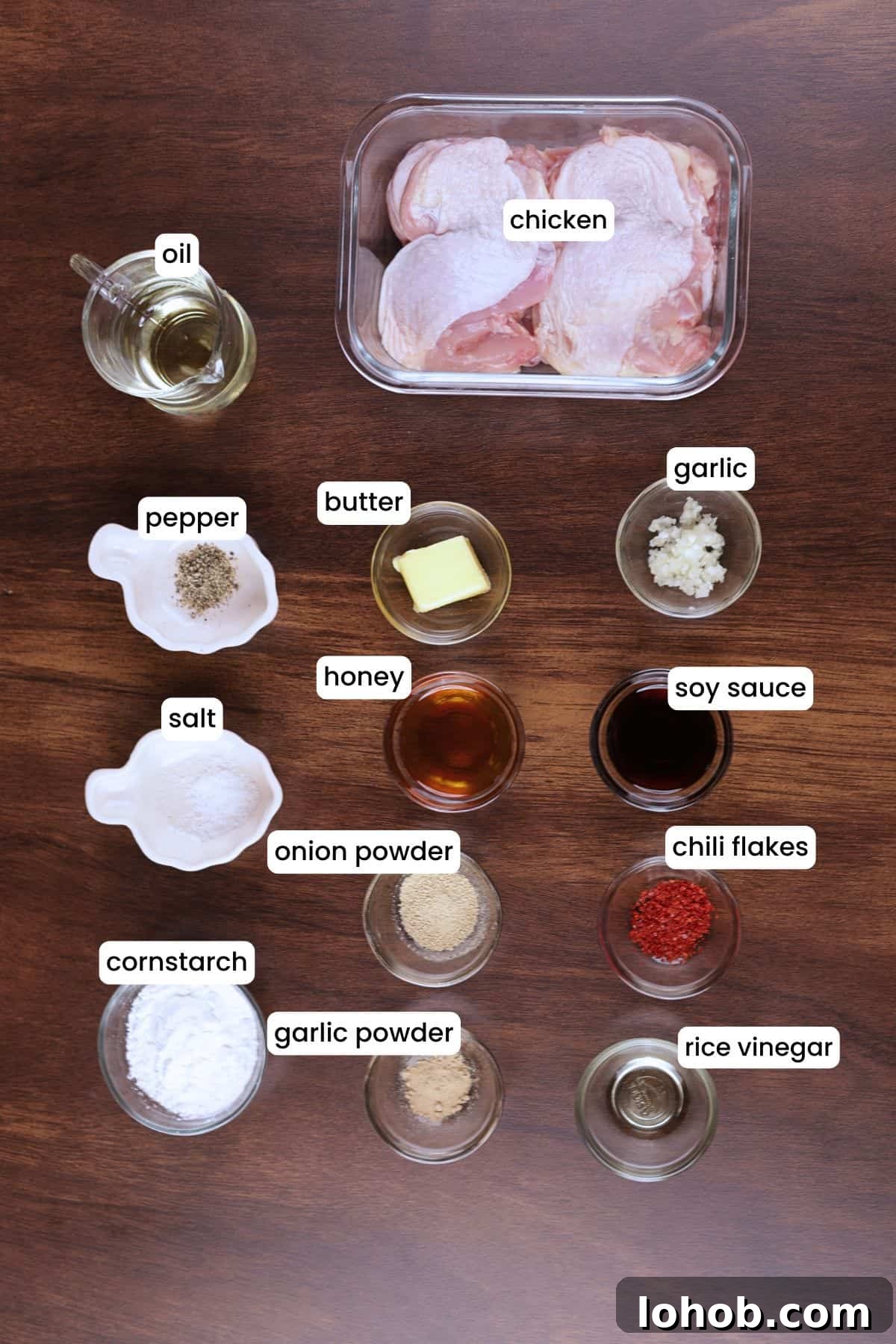 Crispy Honey Garlic Chicken Thighs — One-Pan Recipe 3 Ingredients for honey garlic chicken thighs including chicken, cornstarch, soy sauce, honey, garlic, butter, chili flakes, and rice vinegar.