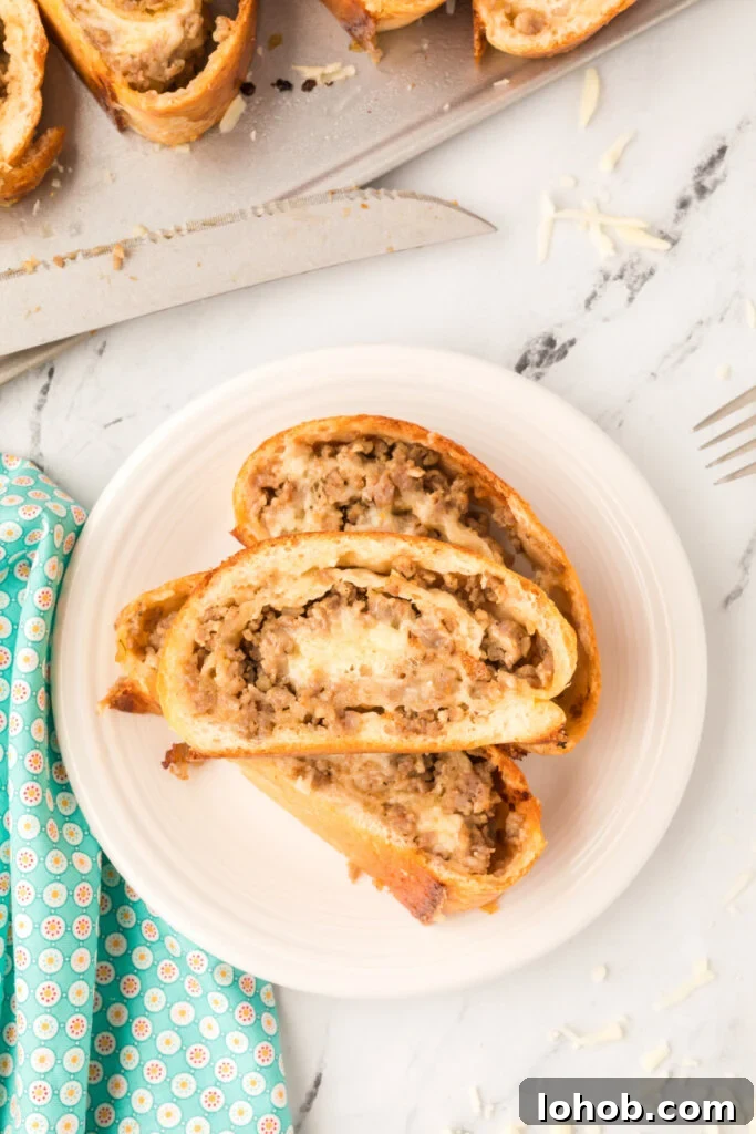 Homemade Sausage Bread Recipe: Savory Stuffed Loaf for Any Meal 5 looking down onto plate with sausage bread slices