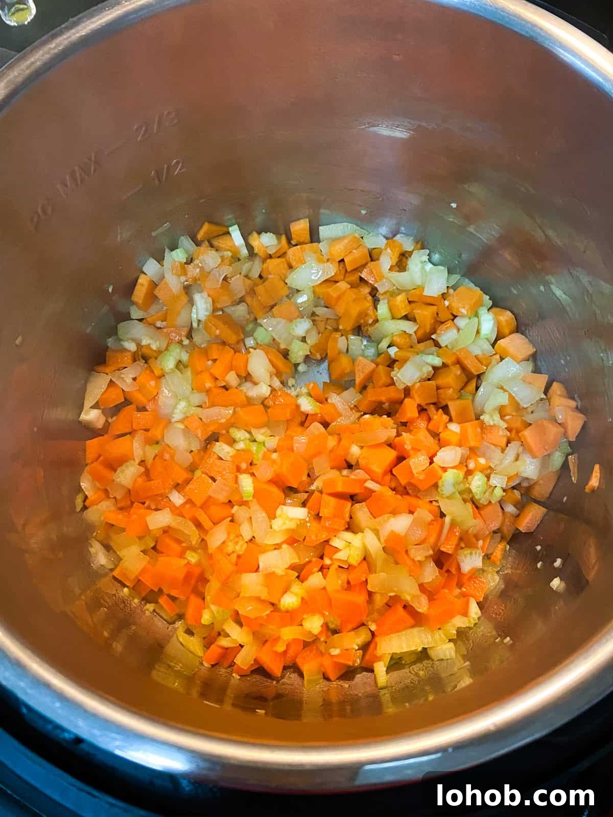 Hearty Vegan Lentil and Vegetable Noodle Soup Recipe 7 Photo of a pan with all the veggies mixed well.