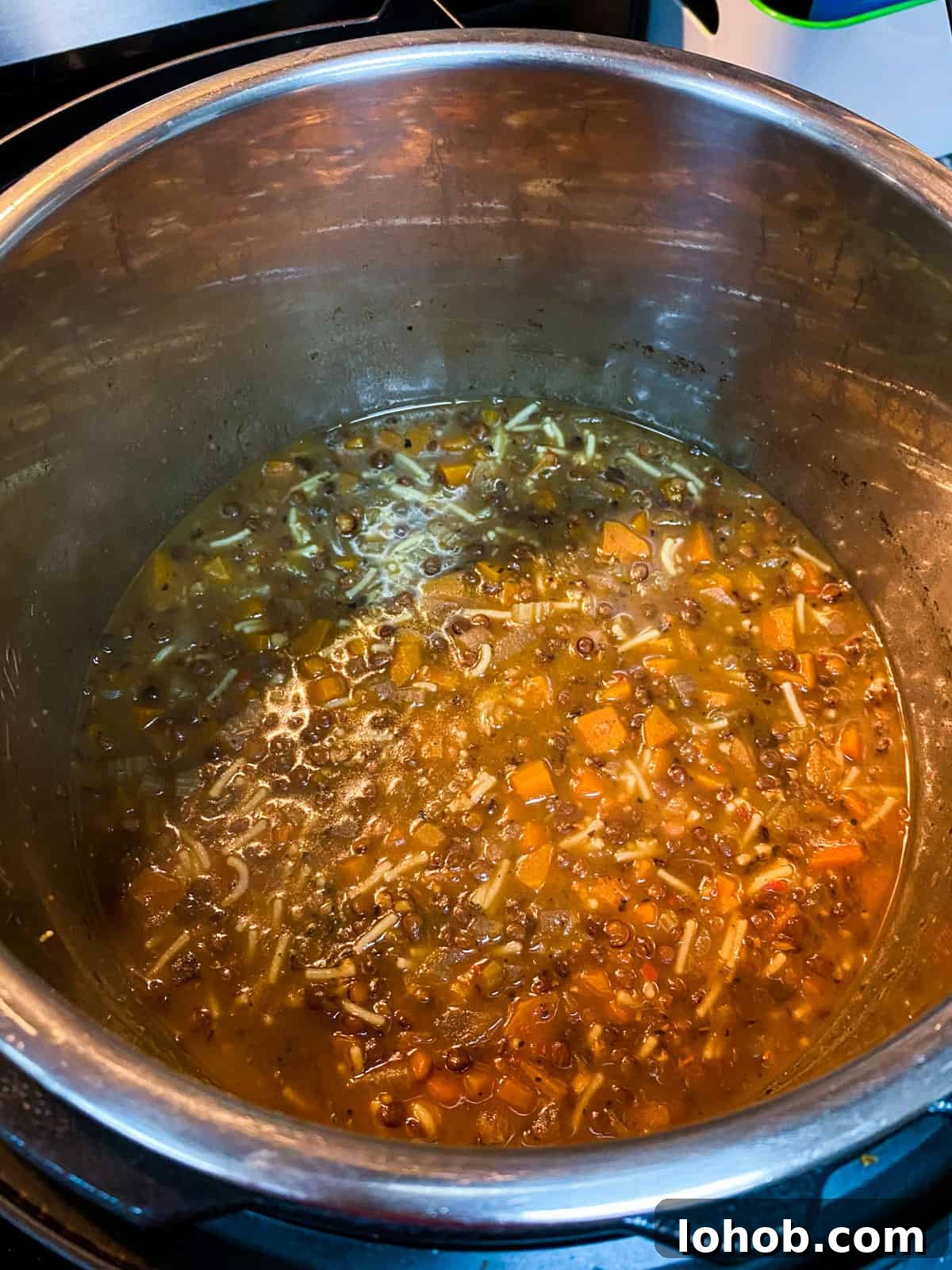 Hearty Vegan Lentil and Vegetable Noodle Soup Recipe 10 Photo showing finished soup in the pan.